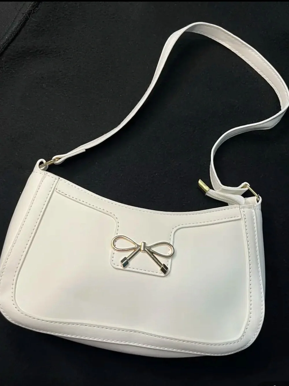 Chic White Shoulder Bag with Gold Bow Accent